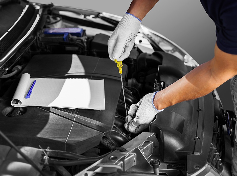 Mechanic changing engine oil - Car Servicing Glasgow